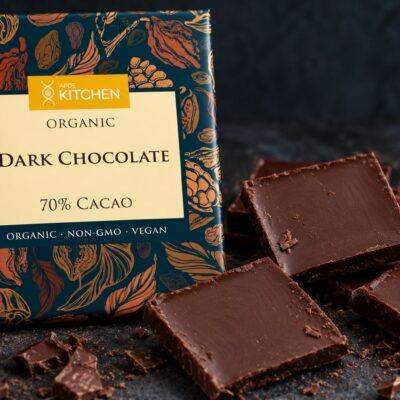 APOE Kitchen Organic Dark Chocolate 70% cacao bar with broken squares on dark slate