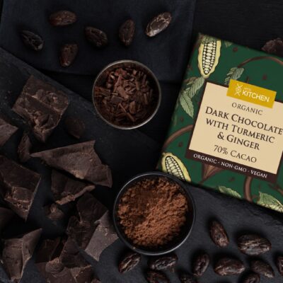 APOE Kitchen Organic Dark Chocolate with Turmeric and Ginger bar with cacao beans, cocoa powder and chocolate pieces