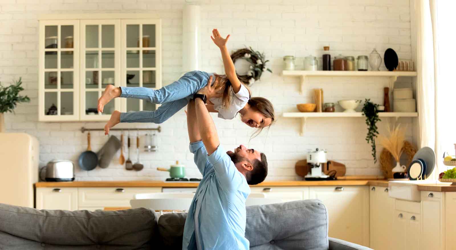 father playing with daughter
